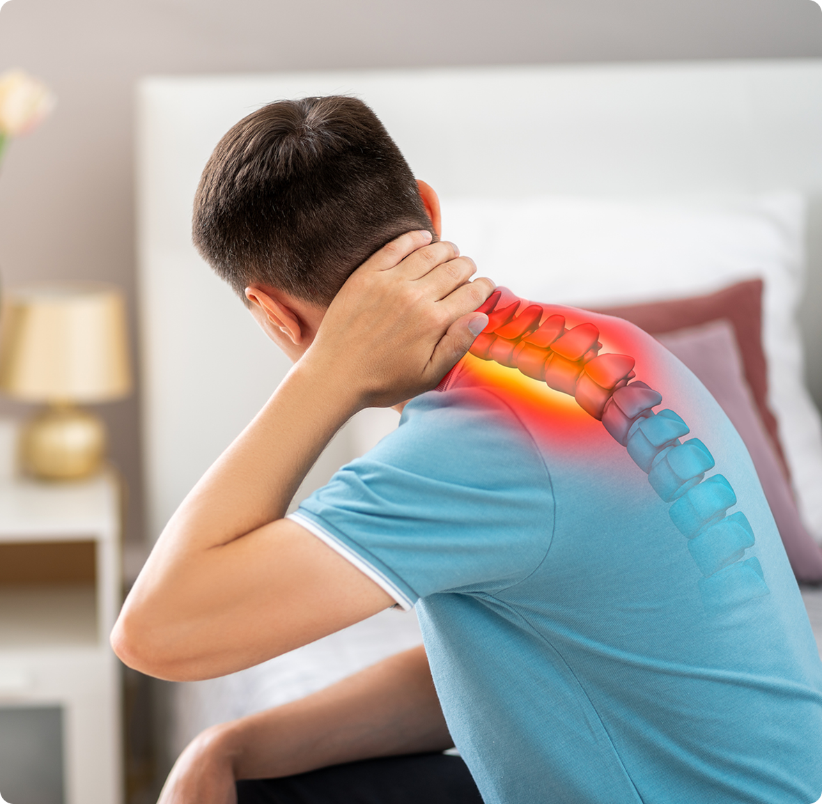 Person experiencing neck discomfort at home